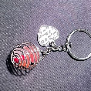 Handmade gemstone caged keychain.